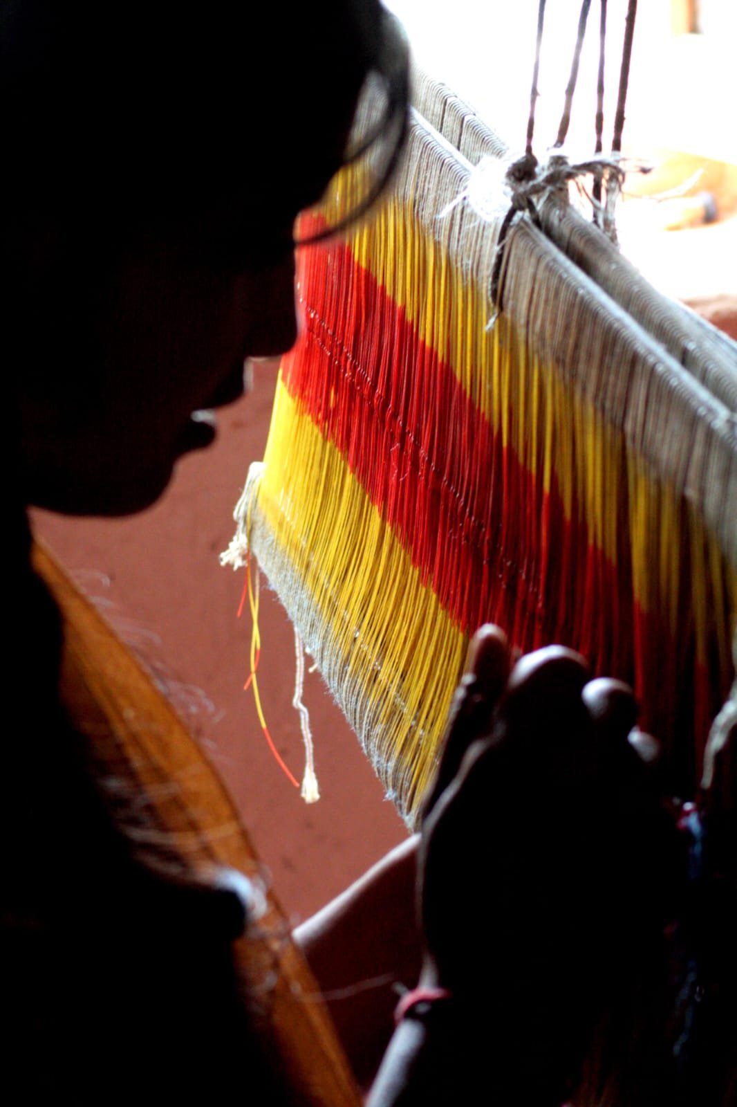 Weaver working on a traditional Himalayan loom